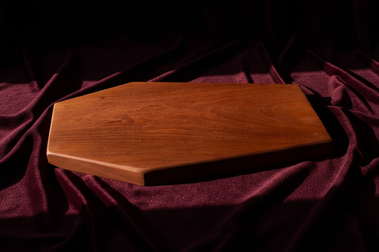 Coffin board on burgundy velvet background